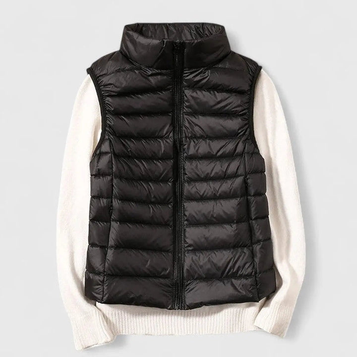 Modern women's lightweight quilted puffer vest. A versatile autumn fashion gilet, essential for layering.