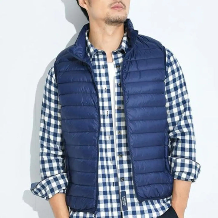 Stylish women's puffer vest, lightweight and quilted, designed with a full zip-up closure for easy wear.
