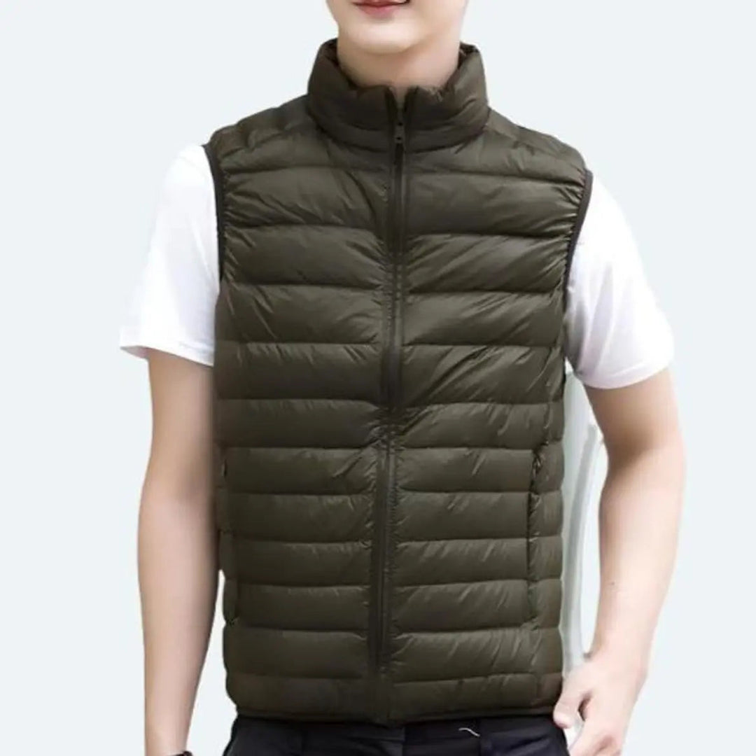 Elegant women's sleeveless quilted puffer vest with a stand collar, offering a chic layering option.