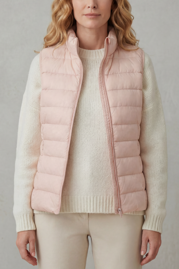 Stylish women's quilted layering vest, a versatile addition to any wardrobe.