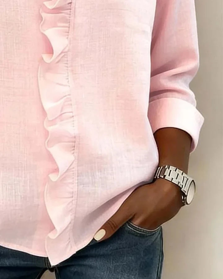 Women's casual yet elegant V-neck blouse. Features lightweight fabric and delicate ruffles.