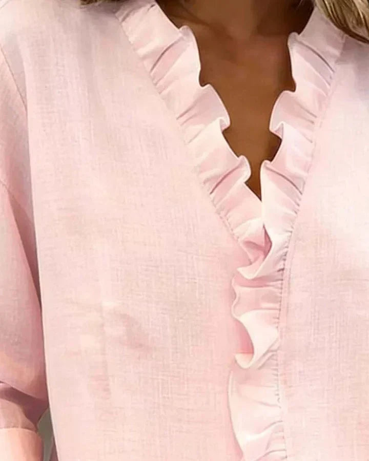 Lightweight women's ruffled V-neck blouse. Long sleeve design for a fashionable & versatile look.