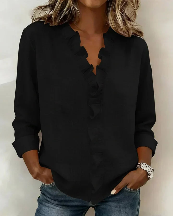 Fashionable women's long sleeve blouse with flattering V-neck and ruffled details. Casual or elegant.
