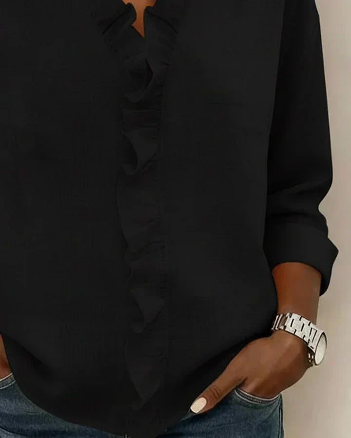 Everyday women's V-neck blouse with long sleeves and ruffled accents. Comfortable and stylish.