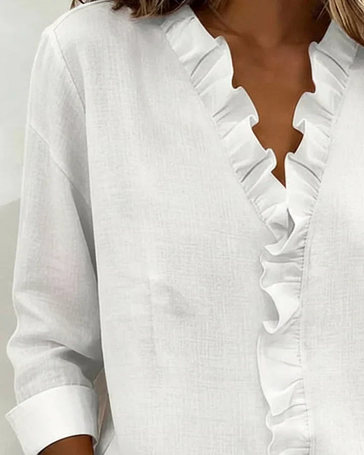 Women's elegant V-neck blouse, lightweight with stylish ruffles. Ideal for office or casual outfits.