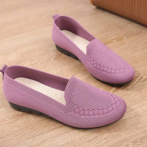 Lightweight walking flats providing excellent foot support for active women.