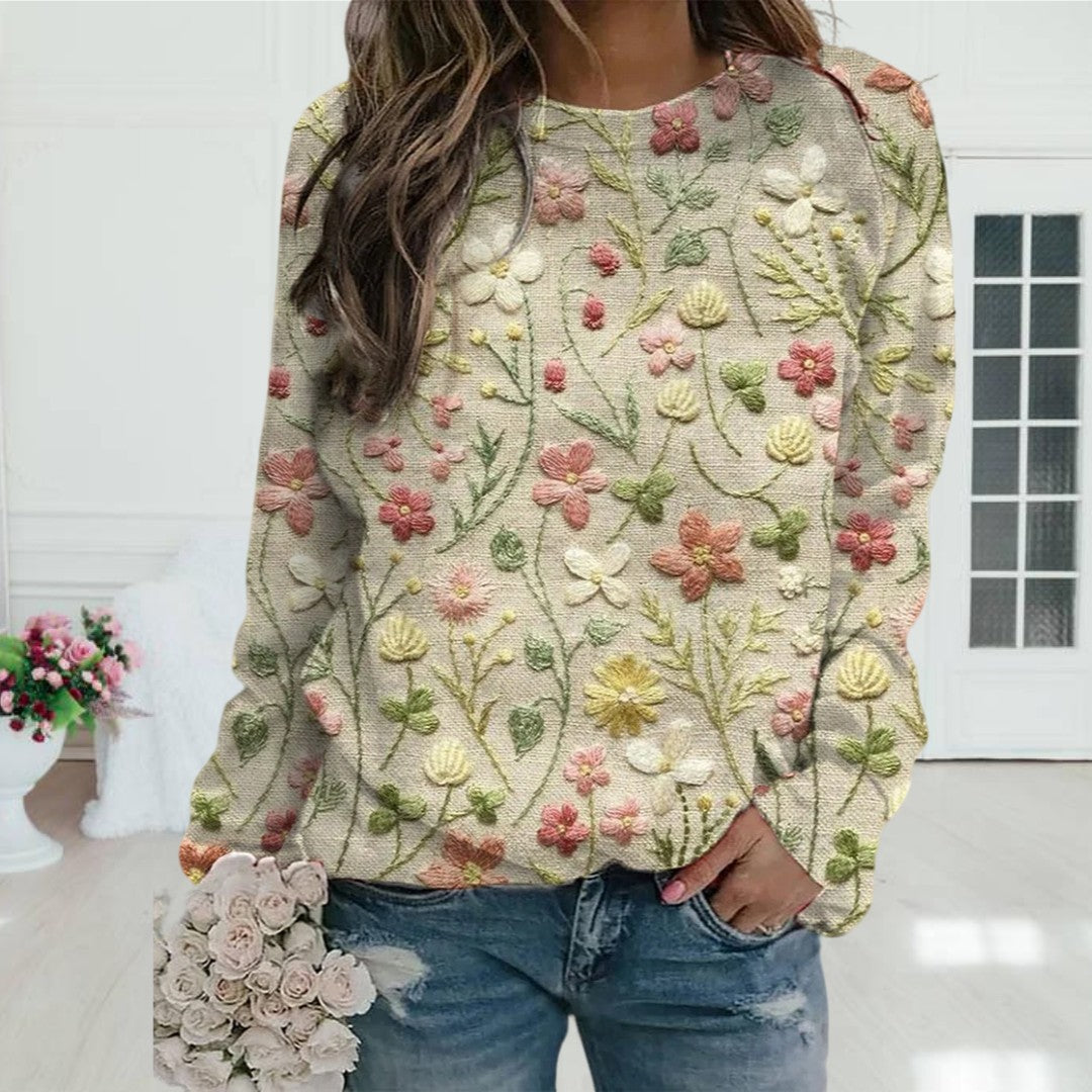 Women's lightweight spring sweater with delicate floral embroidery, a comfortable crew neck, perfect for elegant casual wear.