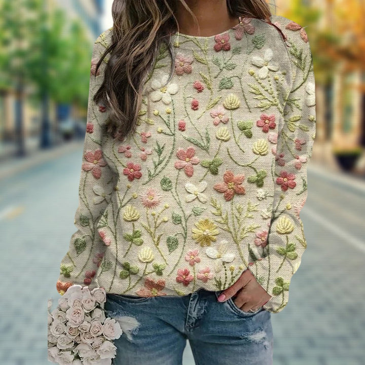 Embroidered floral knit women's crew neck sweater, a versatile and lightweight spring fashion piece for any casual look.