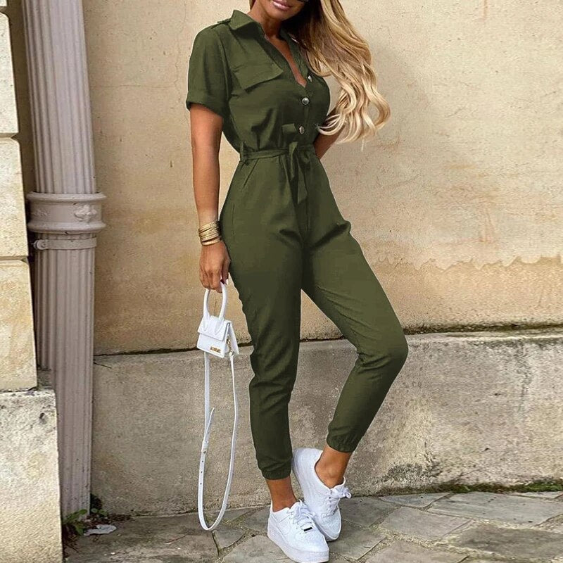 Lightweight women's short sleeve jumpsuit featuring structured fit, button front, and waist tie detail.