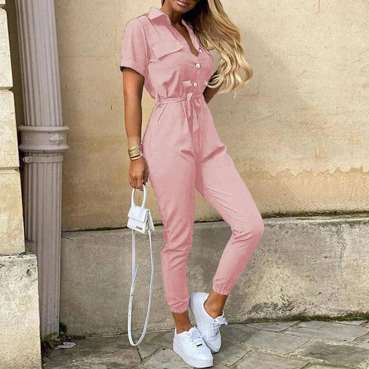 Stylish women's button-front jumpsuit, structured short sleeve, with a flattering waist tie.