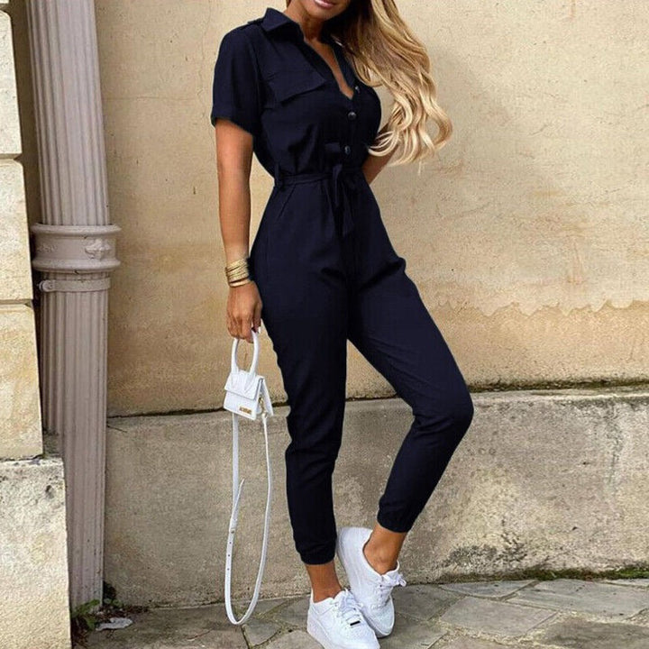 Women's elegant short sleeve jumpsuit, structured design, featuring button details & a cinched waist.