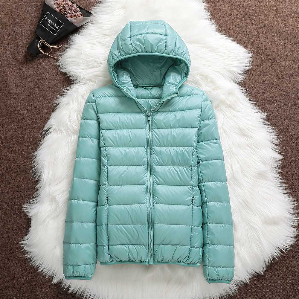 Cozy women's lightweight down jacket, waterproof & breathable, ideal for active winter lifestyles.