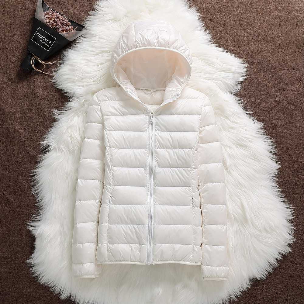Smart women's waterproof down jacket, lightweight design, offers warmth and protection from elements.