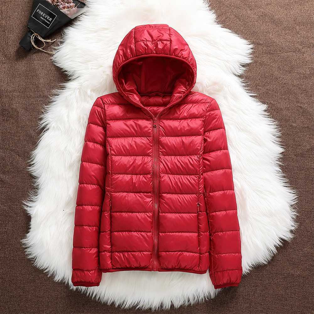 Functional women's lightweight down jacket, waterproof winter coat, durable and comfortable for travel.