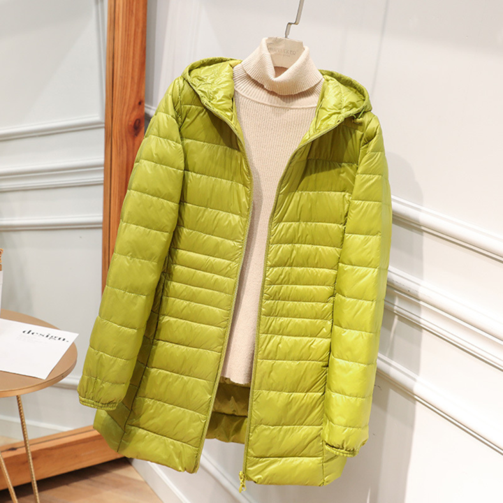Comfortable women's lightweight down jacket, waterproof and travel-friendly, perfect for winter adventures.