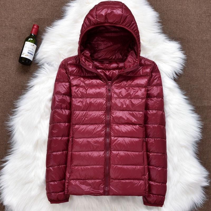 Elegant women's lightweight down jacket, waterproof and cozy, perfect for stylish winter adventures.