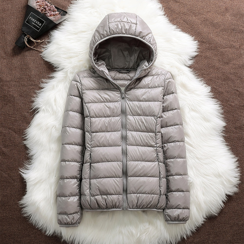 Versatile women's lightweight travel jacket, waterproof, suitable for all winter activities.