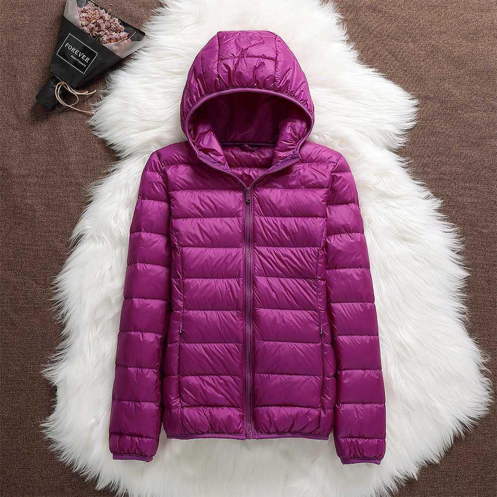 High-quality women's waterproof down jacket, lightweight and insulated for superior winter warmth.