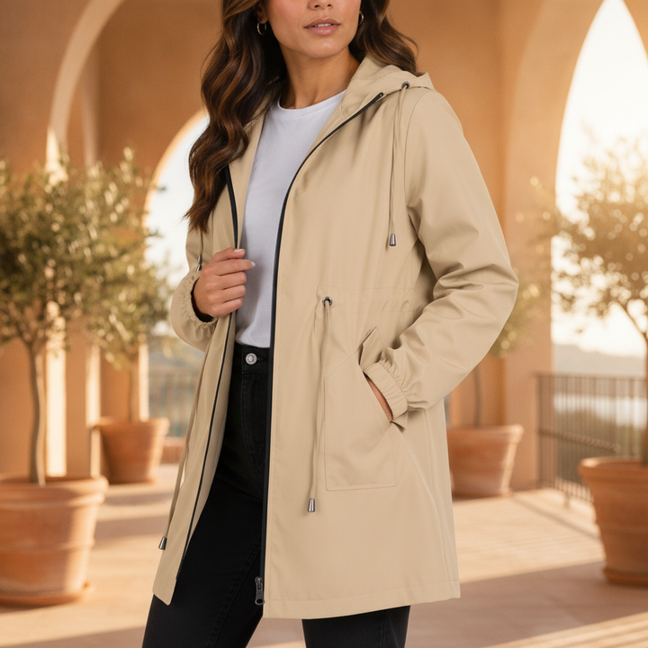 Women's lightweight waterproof raincoat with hood, perfect for spring and travel. Stylish & functional rain jacket.