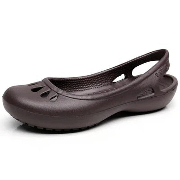White women's travel sandals, lightweight and waterproof slingbacks with comfortable cut-out features.