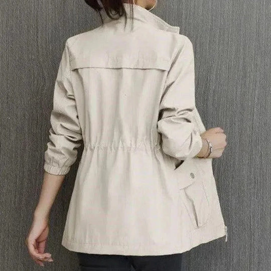 Chic women's waterproof trench coat, lightweight, practical outerwear for travel, office wear & daily errands.