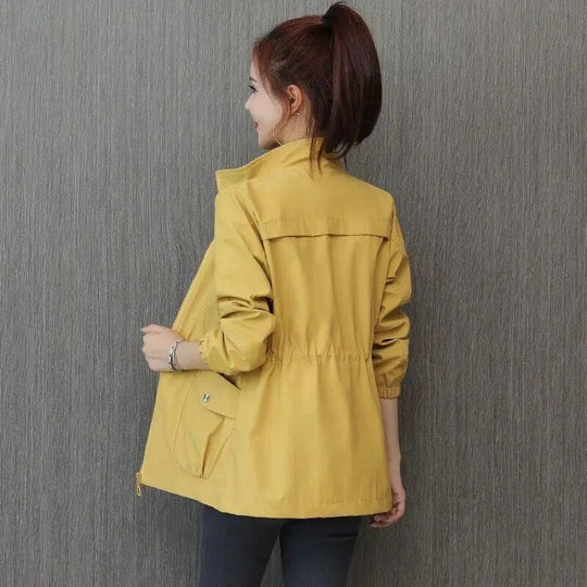 Women's lightweight waterproof trench coat, ideal for all seasons. Chic, versatile rain jacket for spring & fall.