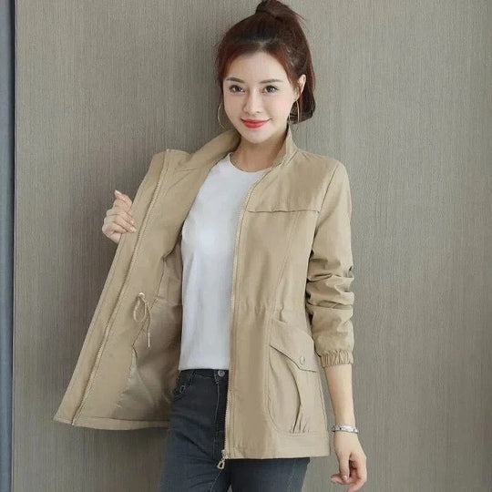 Elegant women's trench coat. Lightweight, waterproof outerwear for a chic all-season look. Perfect for spring/fall.