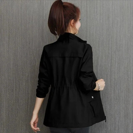Durable women's lightweight trench coat, waterproof. Stylish spring outerwear & fall fashion essential. Versatile.