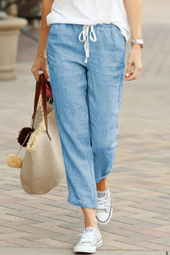 Ladies' comfortable cropped linen pants featuring an elastic drawstring waist, perfect for casual spring and summer.