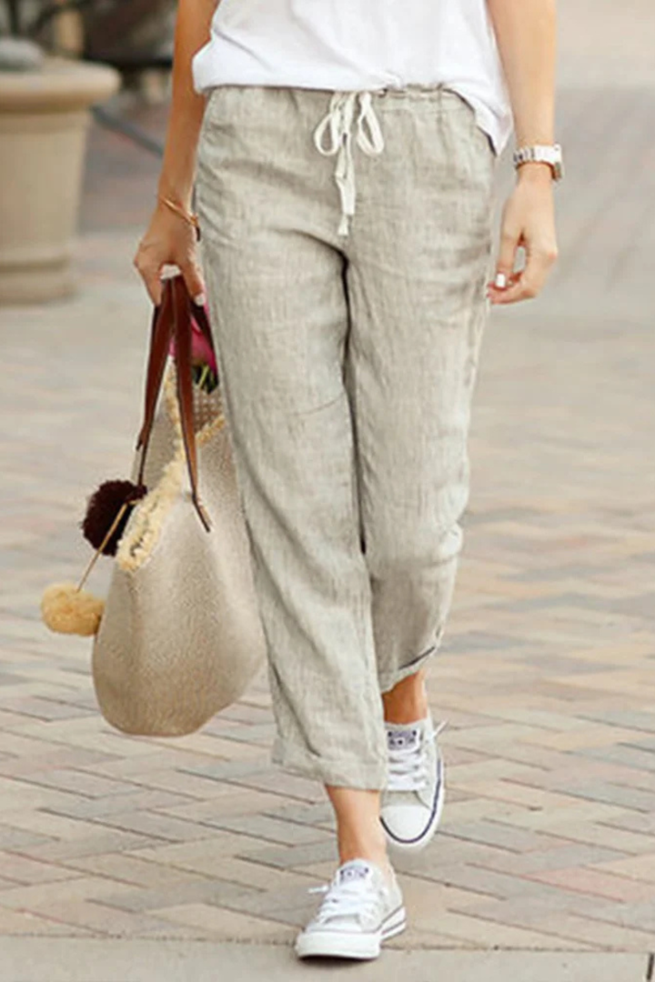 Breathable linen blend cropped trousers for women, featuring a stylish drawstring waist for adjustable comfort.