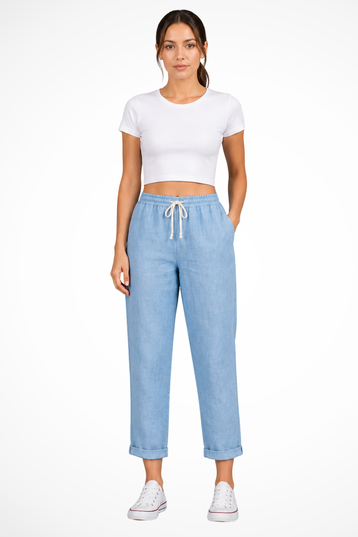 Modern cropped linen trousers for women, designed with a comfortable drawstring waist for a relaxed fit.