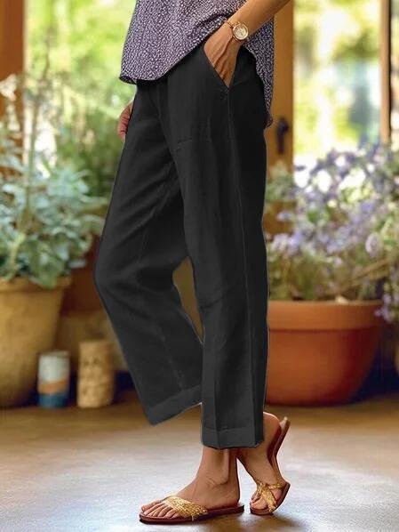 Casual women's tapered linen trousers, cropped, versatile for summer outings or relaxed smart casual wear.