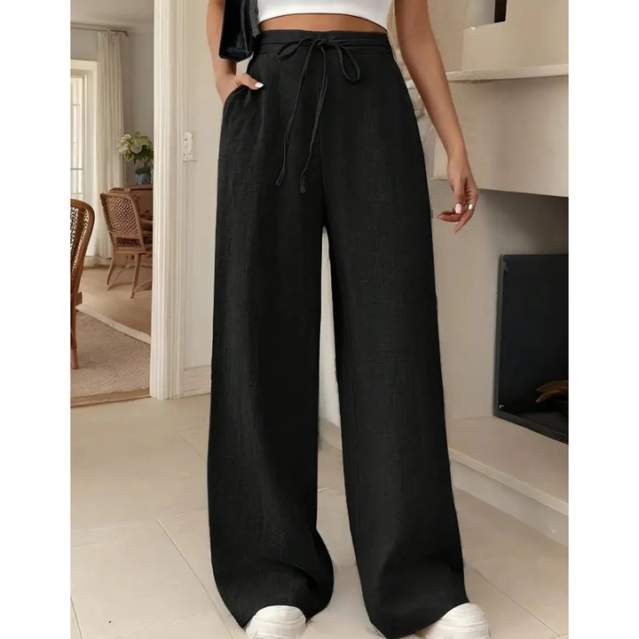 Elegant women's wide leg linen trousers featuring a comfortable relaxed fit and practical drawstring waist.