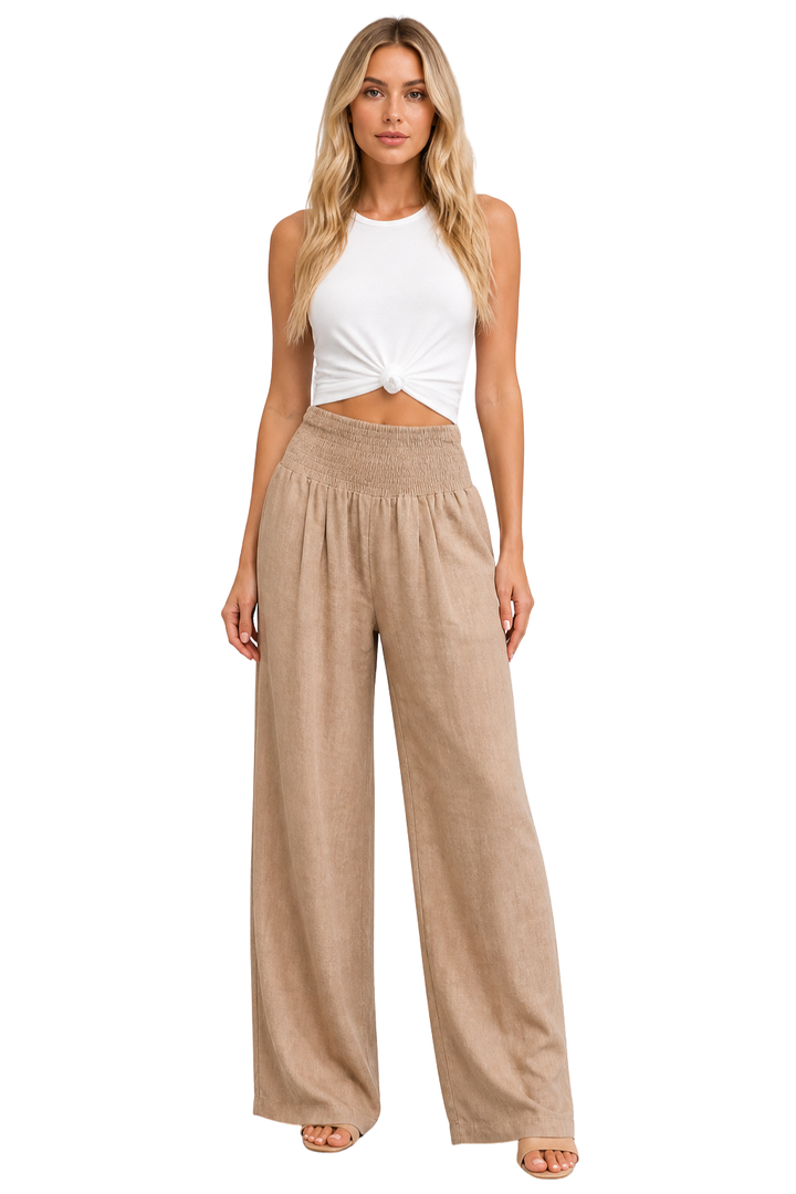 Women's linen wide leg trousers with shirred elastic waist for comfortable summer style.