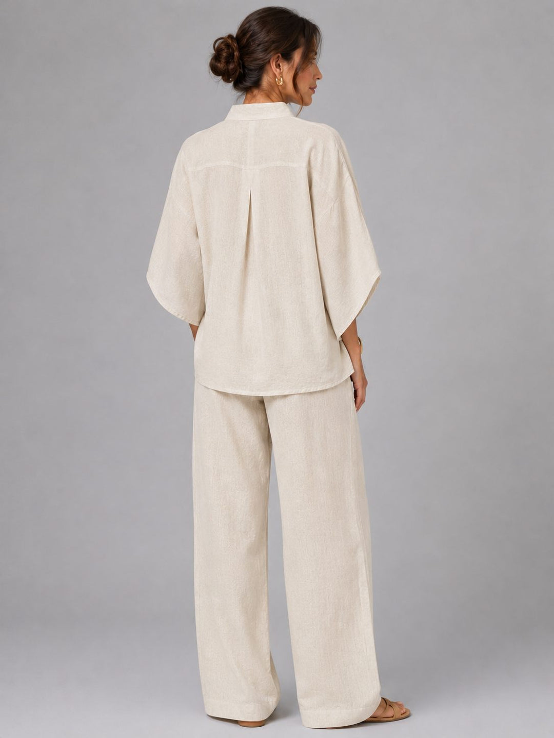 Versatile women's linen set: wide leg pants & button-up top, designed for casual outings & warm weather.