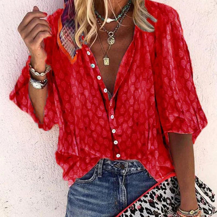 Stylish women's printed long-sleeve blouse for summer. Casual button-down top with a relaxed fit.