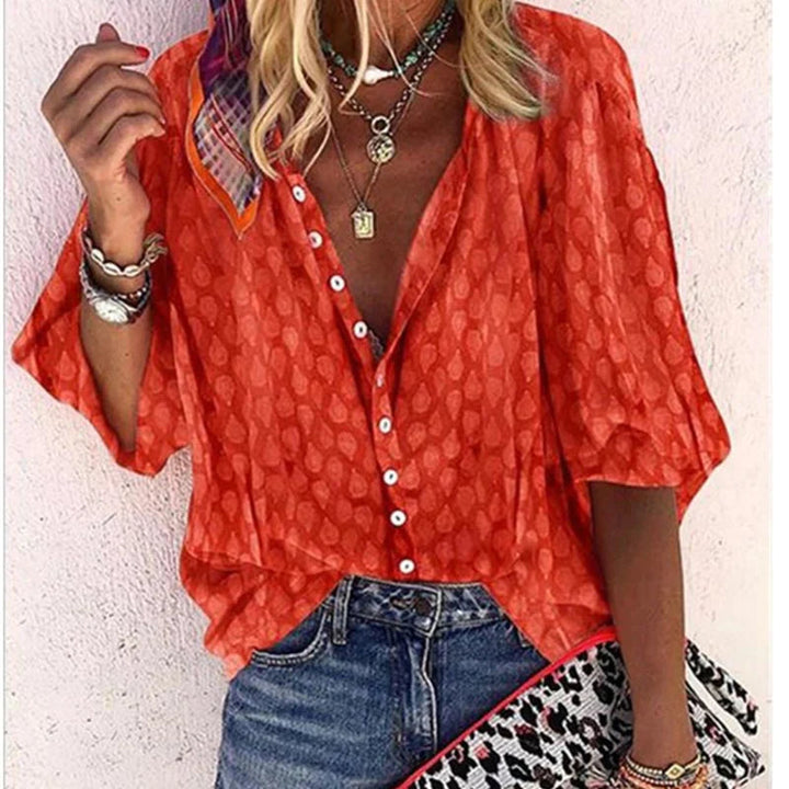 Women's casual printed button-down blouse. Long-sleeve summer top with a relaxed fit for fashion.