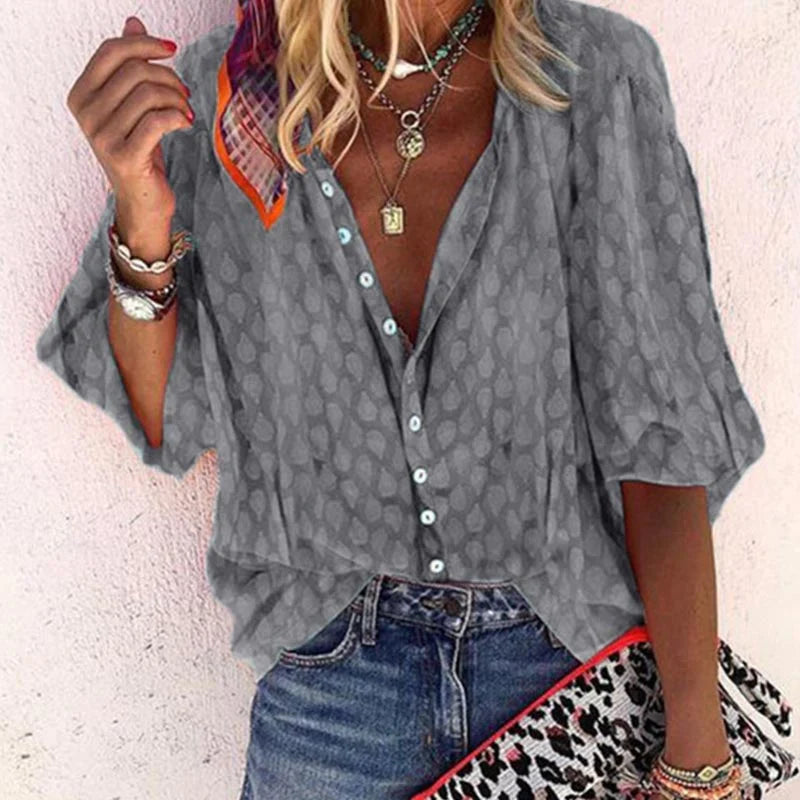 Vibrant women's long-sleeve button-down blouse for summer. Printed casual top with a relaxed fit.