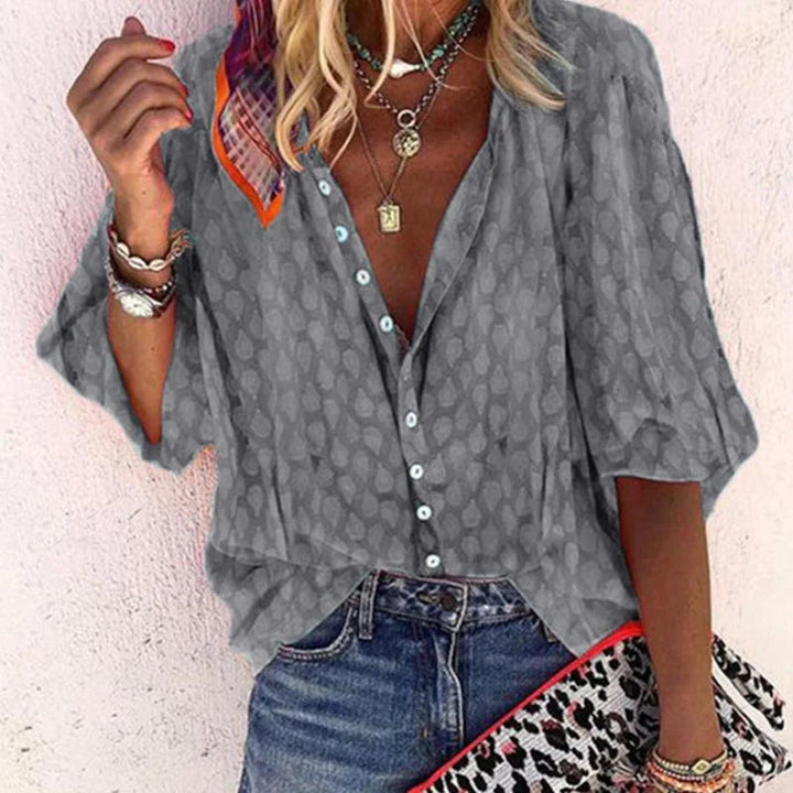 Vibrant women's long-sleeve button-down blouse for summer. Printed casual top with a relaxed fit.