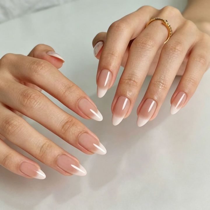 Women's long almond press-on nails featuring a classic French tip design. Perfect for an instant, elegant manicure.