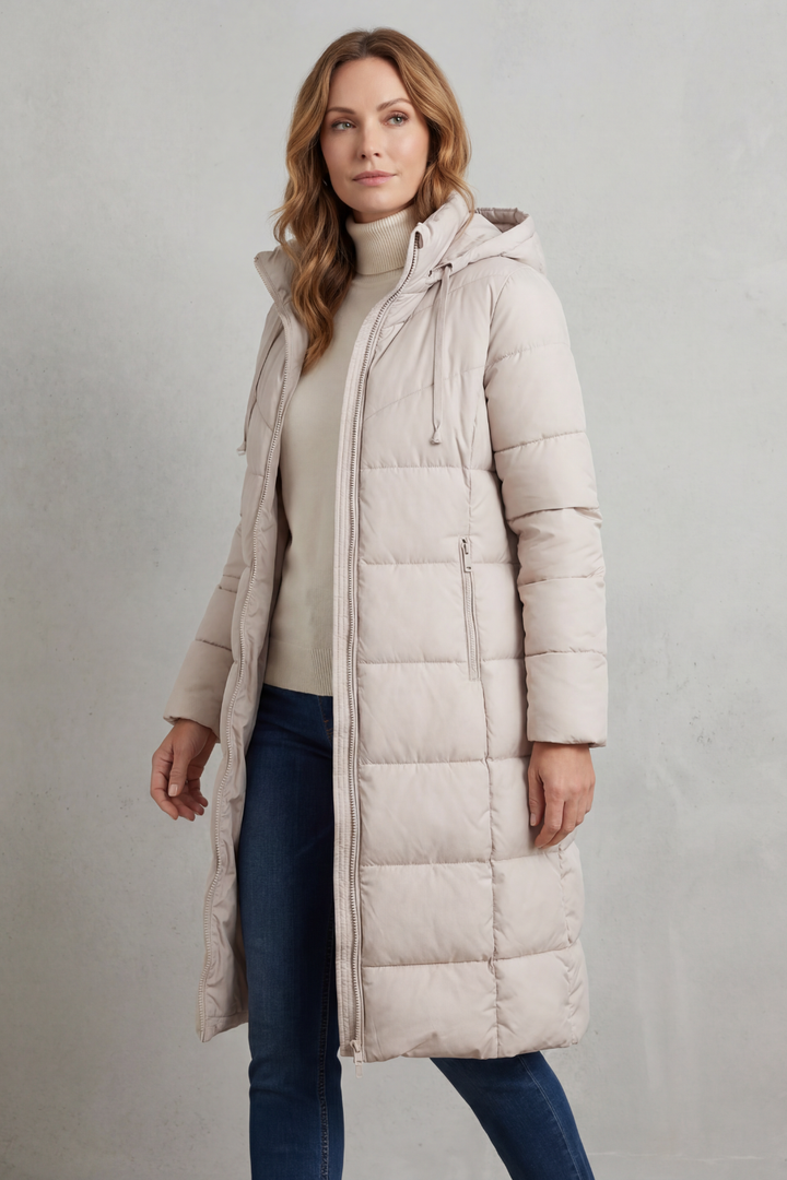 Warm ladies' long quilted puffer coat with a flattering fit, ideal for cold weather.