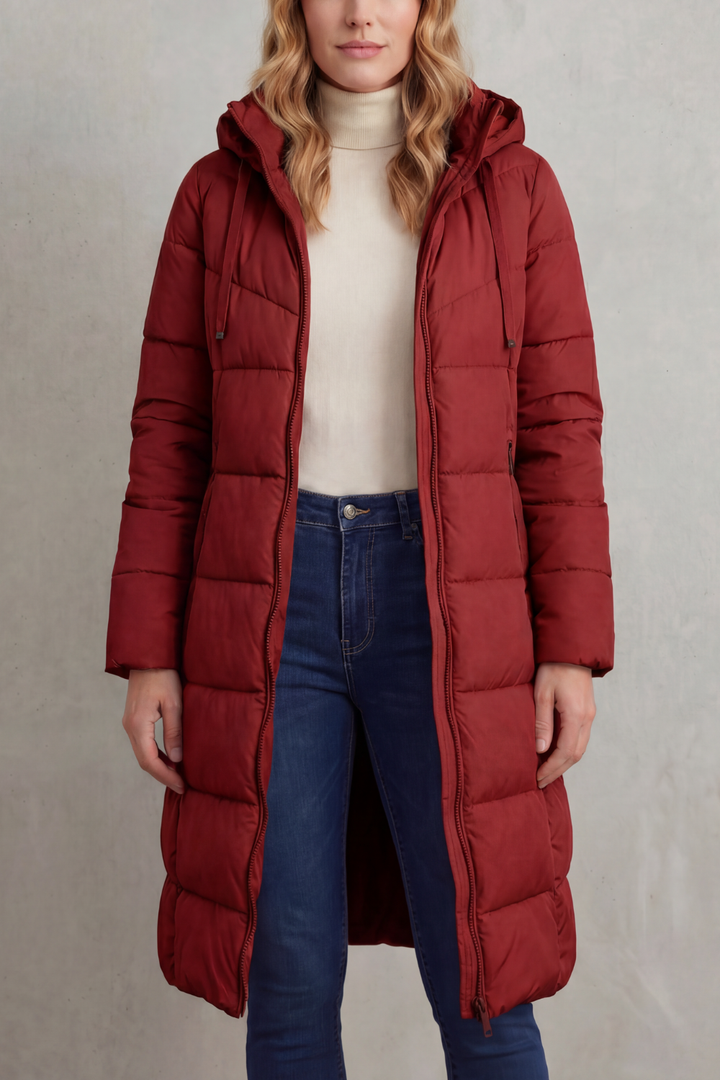 Cozy women's extended length quilted puffer coat in black, essential for warm winter style.