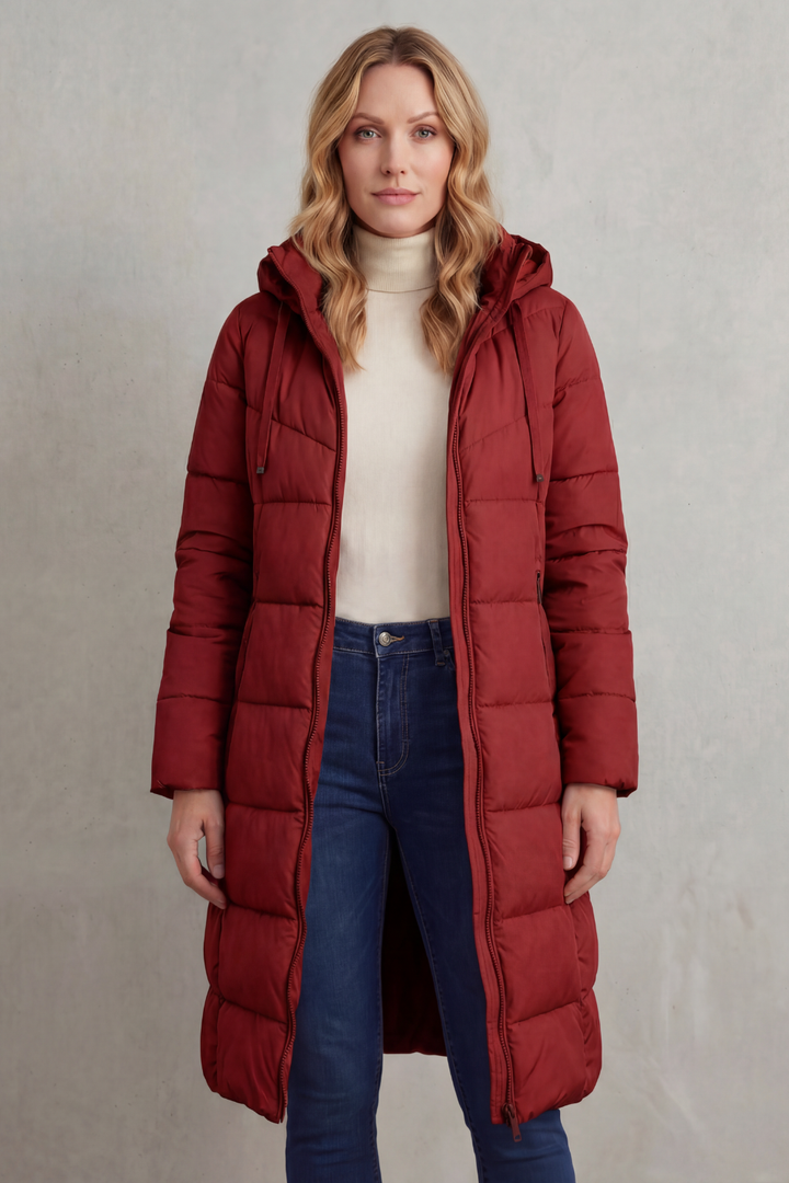 Long women's ivory quilted puffer jacket, offering warmth & a chic design for cold weather.