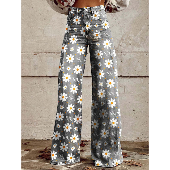 Women's long denim pants with vibrant floral print, perfect for casual wear and everyday style.