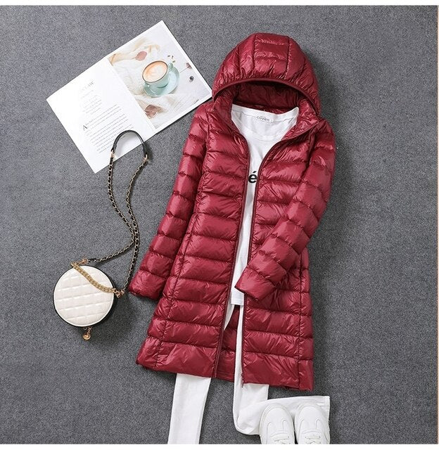 Women's long down jacket with detachable hood, black. Ideal for winter warmth & stylish cold weather outerwear.