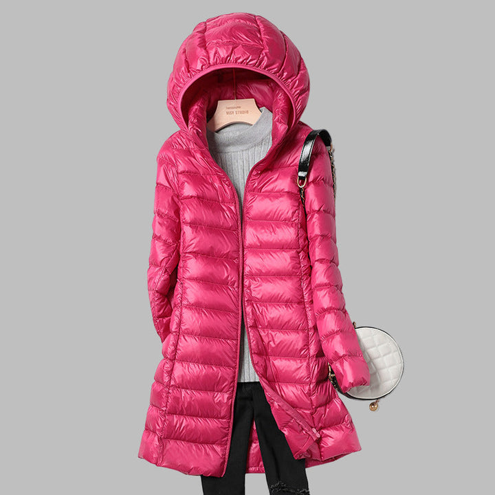 New women's long winter jacket. Warm down coat with a practical detachable hood, perfect for cold weather outerwear.