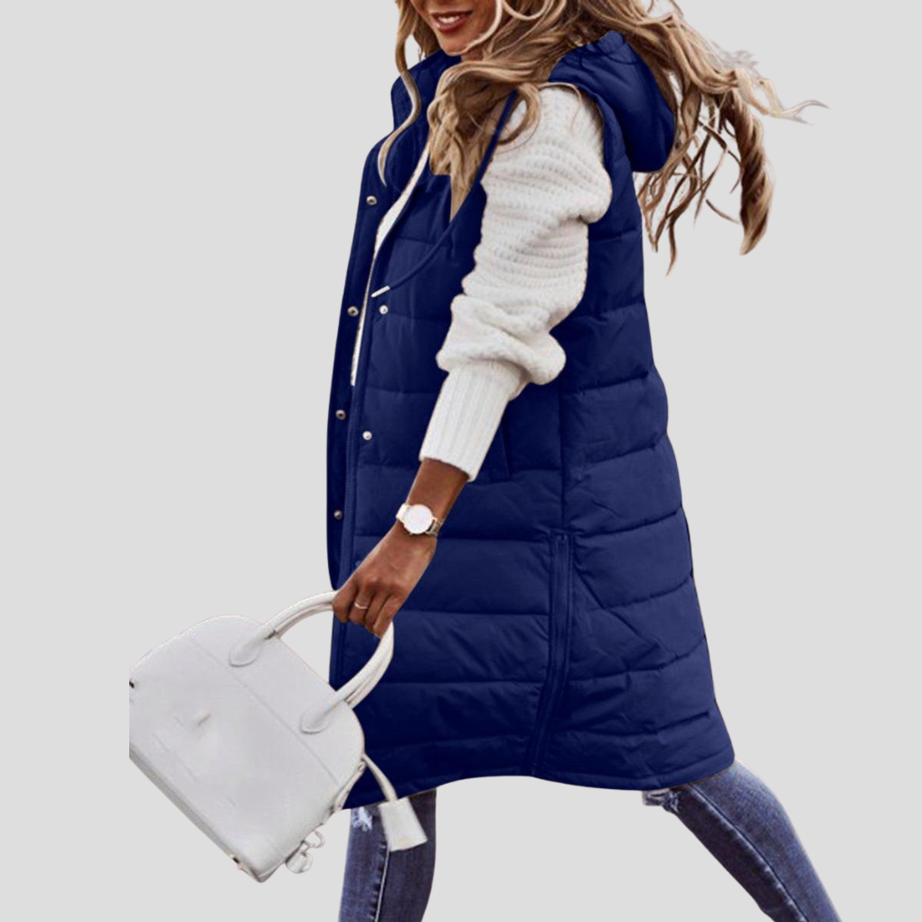 Chic women's longline hooded vest. Comfortable sleeveless padded jacket, versatile outerwear for cooler days.
