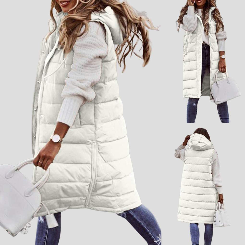 Stylish long hooded bodywarmer for women, a versatile padded vest perfect for fall & winter layering.