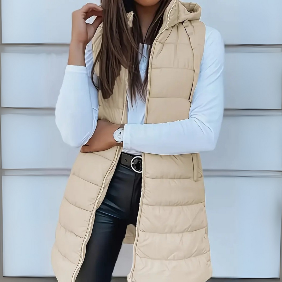 Warm & lightweight women's hooded long puffer vest, designed for comfortable casual wear in fall and winter.