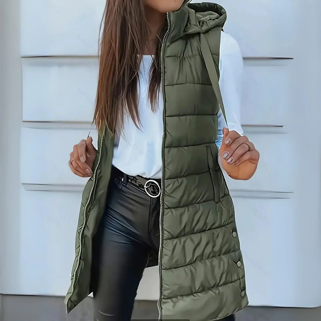 Stylish women's long hooded puffer vest, a versatile and warm sleeveless outerwear for cool weather.